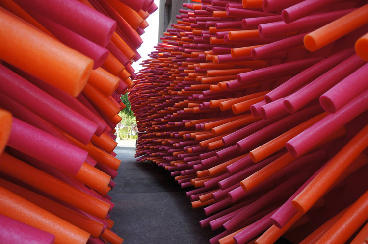 6-hundreds-of-pool-noodles-invade-an-abandoned-alley-in-quebec-city-for-the-delirius-frites-installation-created-by-creative-collective-les-astronautes-the-installation-creates-a-total-environment-tha