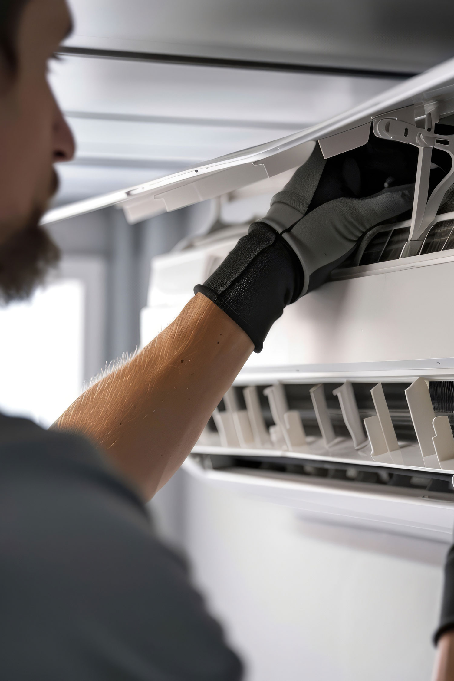 Technician servicing air conditioning unit to ensure cooling