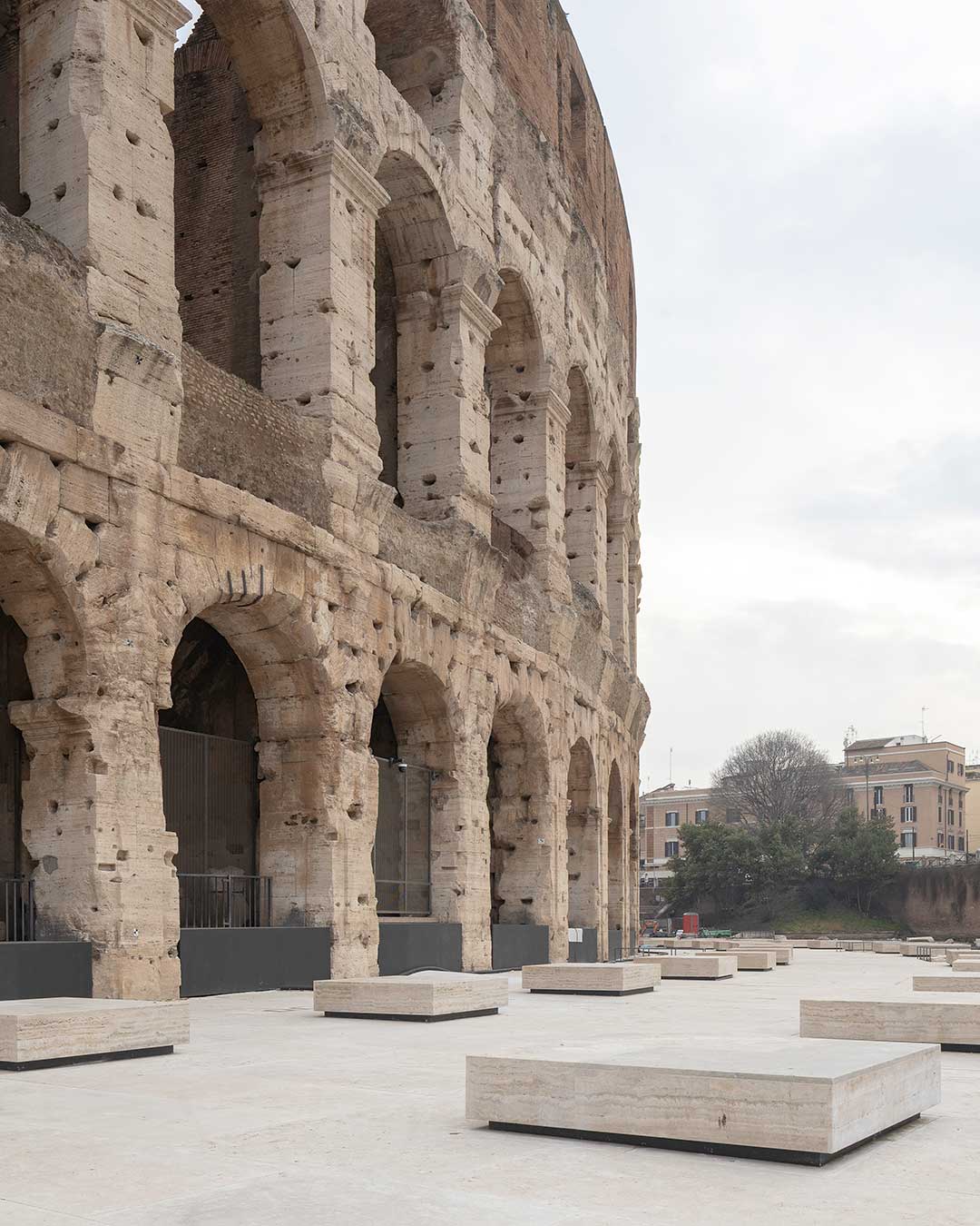 The southern ambulatory of the Colosseum undergoes a profound transformation, as Stefano Boeri Interiors and Giorgio Donà reconcile the contemporary urban fabric with the monumental scale of Rome’s most iconic landmark. By descending approximately one meter into the earth, the team has revealed the ancient crepidine—the double-stepped perimeter that originally anchored the amphitheater. This physical shift allows visitors to experience the true verticality of the structure, moving from a modern, flattened perspective toward an authentic encounter with the depth of Roman history.

The materiality of the project is a sensory tribute to the past. Using Classic Travertine, the new ground plane features 44 extruded elements that serve as both historical markers of lost pillars and public seating. From the bush-hammered tactile cues underfoot to the "archaeological window" revealing hidden foundations, every detail is designed for reversibility and inclusivity. This is not a static relic, but a living urban space restored to its original human scale.

via #urdesignmag 
architects @stefanoboerinteriors @stefano_boeri 
images @simonamurrone 

#StefanoBoeriInteriors #Colosseum #RomeArchitecture #HeritageDesign #Travertine #UrbanIntervention #Archaeology #ItalianDesign #Restoration #ArchitectureLovers #DesignInnovation #AncientRome