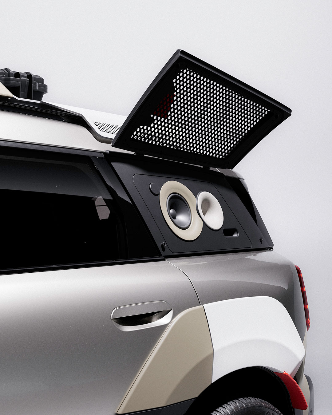 Sand versus midnight. Light graphic persona against technical monochrome. These two MINI Countryman S ALL4 builds are a study in contrast—yet both share a singular obsession: sound. The rear side windows are gone, replaced by cast polymer granite speaker housings for crisp, uncolored outdoor audio. 20-inch rims wear closed-off 3D-printed covers that visually echo loudspeaker diaphragms. On the roof, laser-cut aluminum and stainless steel mesh recall professional monitor grilles. And tucked into a custom 3D-printed flank housing: a classic yellow Sony Walkman, a private analogue counterpoint to the massive communal stage. Raised ride height. Off-grid ready. This is not a crossover. It is a mobile festival hub.  #MINICountryman #Vagabund #CarDesign #SpeakerDesign #Walkman #FestivalCulture #OffGridAudio #BespokeBuild #AutomotiveArt #MINILifestyle #SoundSystem #EventVehicle