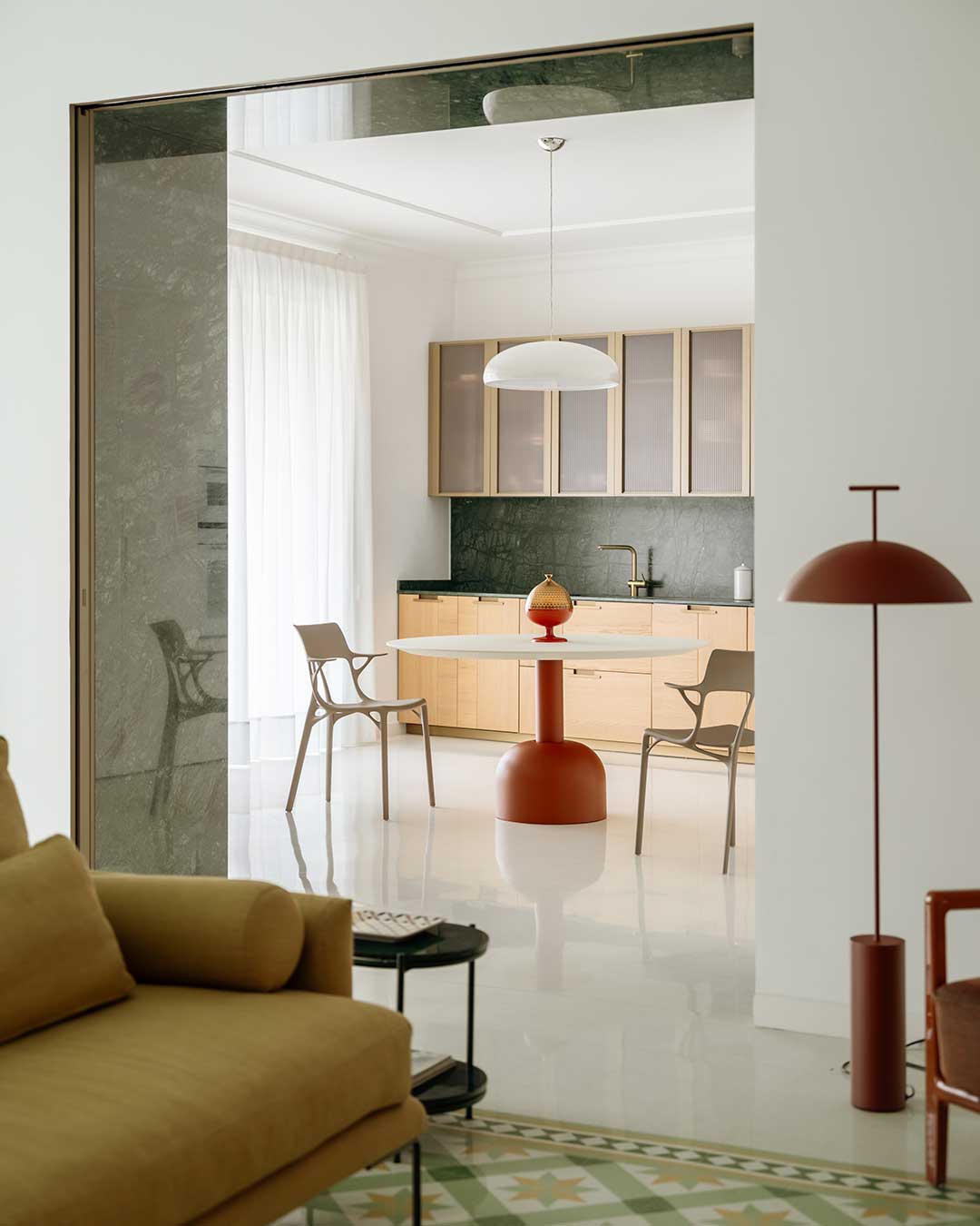 Three materials carry the entire renovation of Elia's Home: terrazzo flooring running throughout, a Verde Guatemala marble portal marking the entrance, and oak paneling defining the private rooms. In-Nova Studio reworked this 280 sqm (3,014 sq ft) apartment inside a 19th-century palazzo in Aversa without adding a fourth.  The restraint is the point — each material appears once, does its job, and gets left alone rather than layered with additional finishes or color.  architects: @in_novastudio
photography: @carlo_oriente  urdesignmag.com — link in bio  #InNovaStudio #InteriorDesign #Aversa #Terrazzo #ItalianRenovation