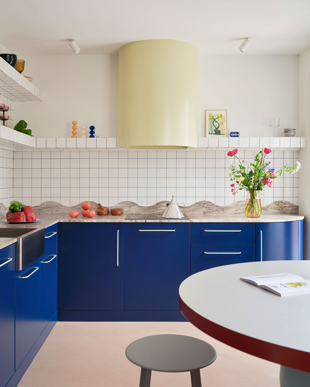 A structural column Bardo wasn't allowed to remove became the loudest design decision in the whole apartment. Wrapped in neon acrylic, it now filters light between the living room and bedroom in Macedonia, a Madrid renovation built around the idea of surprise. Every room reads as its own scene: a curved aubergine wall in the dining area, a kitchen where a stone countertop's undulating edge reads almost like topography, and two bathrooms — one dreamlike and saturated, one deliberately calm — that were never meant to feel like a matching pair. architects: @bardo.arq / @emidomingo
photography: #germansaiz urdesignmag.com — link in bio #Bardo #MacedoniaApartment #MadridRenovation #InteriorDesign #NeonAcrylic