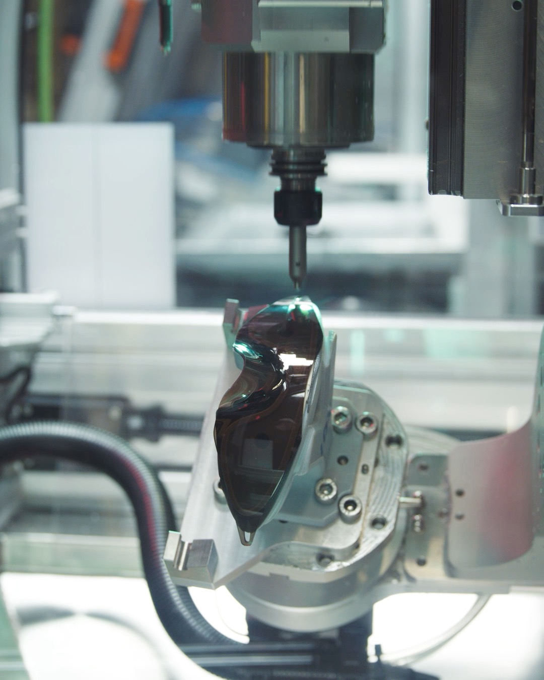 Behind the scenes at the Moonbase1 lab. A closer look at the precision engineering behind the new Oakley wrapped-lens eyewear prototype, debuted on Kiko Kostadinov's Paris Fashion Week runway. The manufacturing process reveals the complex machining required to shape the continuous, single-lens structure before it receives its artwork-inspired pattern. No release date has been confirmed. @oakley | @kikokostadinov
video courtesy of Oakley urdesignmag.com — link in bio #Oakley #KikoKostadinov #ParisFashionWeek #Eyewear #Moonbase1 #IndustrialDesign