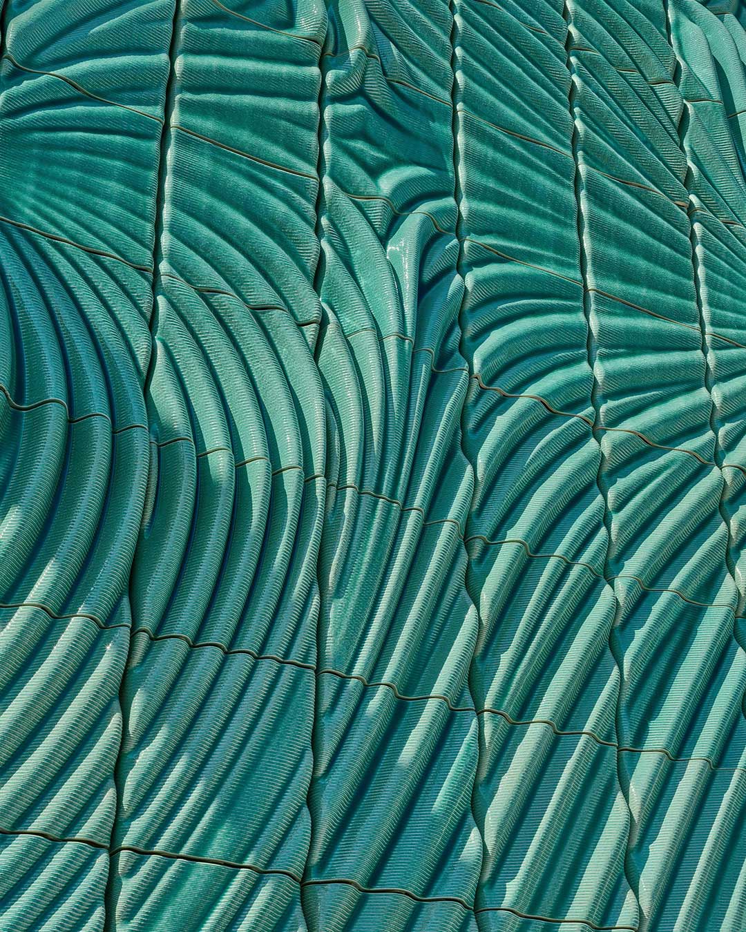 322 robotically 3D-printed ceramic tiles now cover the brick façade of Switchstation Beverwijk in the Netherlands, the electricity substation's plain industrial shell recast as a glazed relief. Studio RAP, the Rotterdam-based ceramics studio founded by Lucas ter Hall and Wessel van Beerendonk, applied its clay-printing process to infrastructure for the first time — moving from galleries and building façades to the anonymous substations that dot the Dutch grid. architects: @studio.rap
images: @pim_top
urdesignmag.com — link in bio #StudioRAP #CeramicArchitecture #3DPrintedCeramics #DutchDesign #InfrastructureDesign