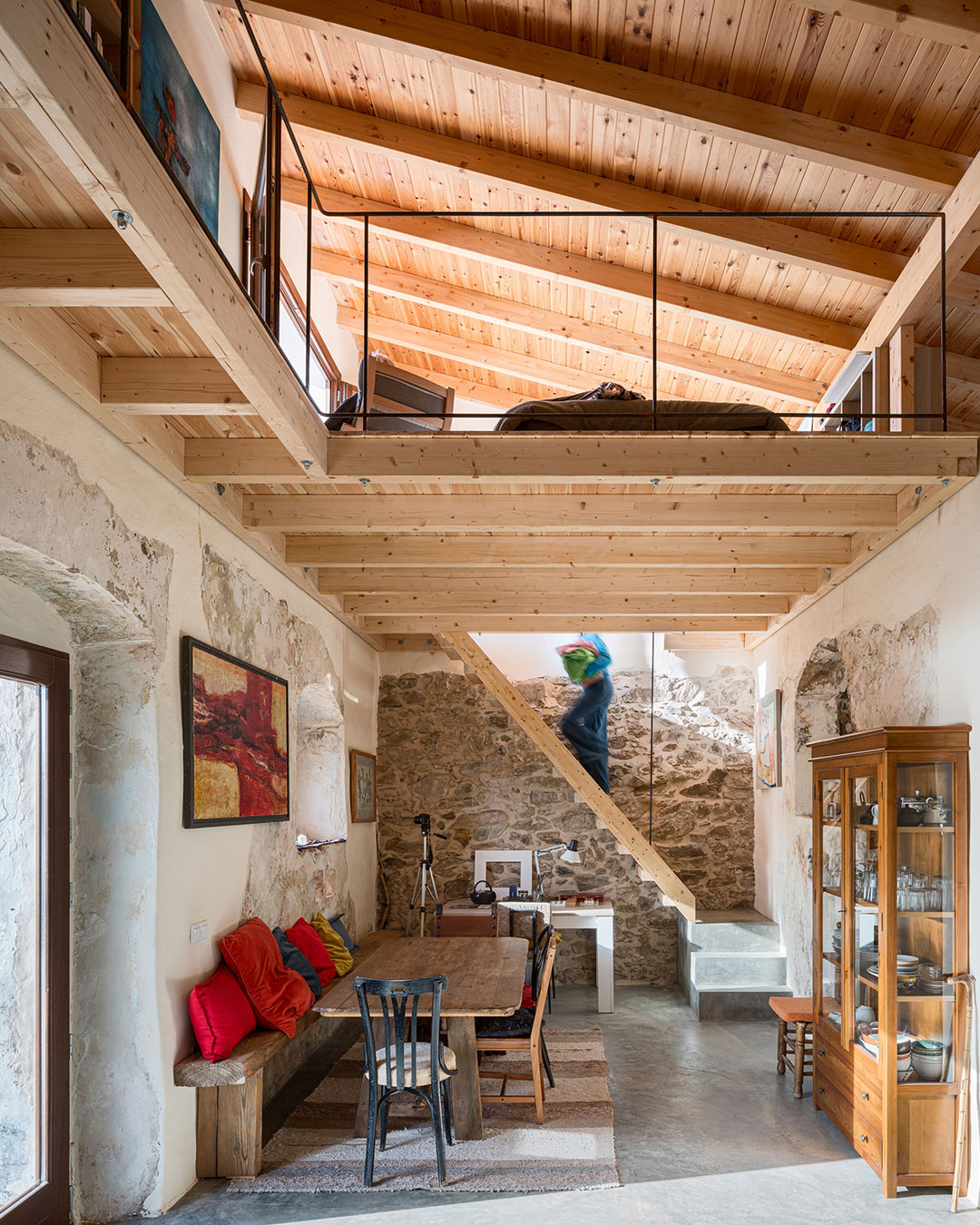 A former Spanish Civil Guard outpost above the Guadiana River had no doors, no floor, and no history anyone wanted to erase. Zurita Studio and Kalibra Arquitectura kept the ruin's stone perimeter as the house's own structure, adding only a discreet extension and letting old plaster sit next to new white render without disguising either. The house runs on thermal mass, cross ventilation and a single roof aperture instead of air conditioning, and privacy inside is handled entirely by geometry — there isn't one door in the plan. architects: @zurita_arq , @kalibra.arquitectura
photography: @juancalagares
urdesignmag.com — link in bio
#PassiveCooling #AdaptiveReuse #SpanishArchitecture #StoneArchitecture #RuinRenovation