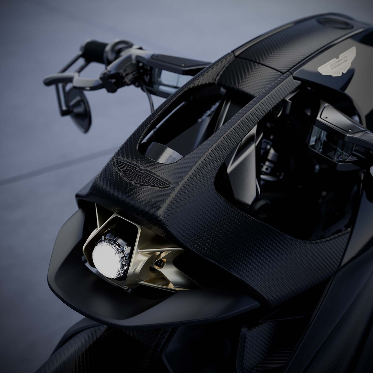 The rear light blades on the AMB 002 Roadster are the same type fitted to the Vulcan, Valkyrie and Valhalla hypercars. Aston Martin's side strake pierces the fairing to frame the headlamp, and the twin oval exhausts carry ribbed heat sinks that echo the Vanquish, DB12 S and DBX S. Underneath, the 1,083cc V-twin is designed, machined and assembled in-house at Brough Superior's headquarters in Toulouse, more than a century after George Brough founded the marque in Nottingham in 1919. Only 300 will be built. Aston Martin and Brough Superior @astonmartin @broughsuperiormotorcycles — AMB 002 Roadster — Toulouse, France
Photography: Aston Martin urdesignmag.com — link in bio #AMB002 #AstonMartin #BroughSuperior #MotorcycleDesign #TitaniumFrame