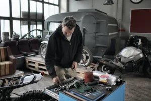 Man works inside carpot turned into garage