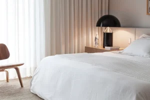 Modern bedroom with table lamp Atollo 235 by Oluce