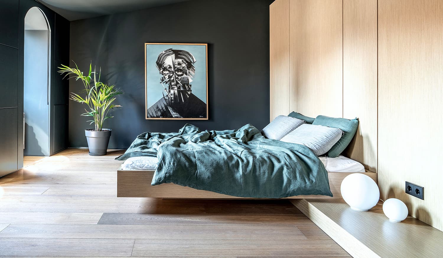 Modern bedroom with artwork on the walls