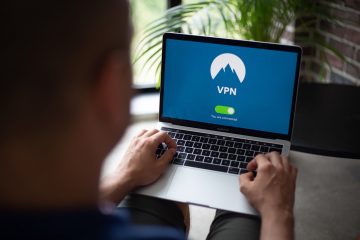 Man surfs the web using a laptop with VPN