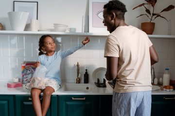 A Man and a Girl in the Kitchen Area