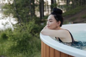 Woman relaxes in the Hot Tub in her backyard