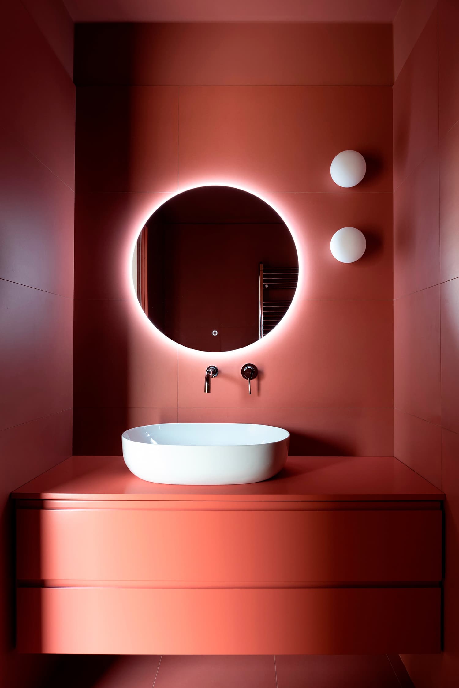 Bathroom with LED-backlit mirror