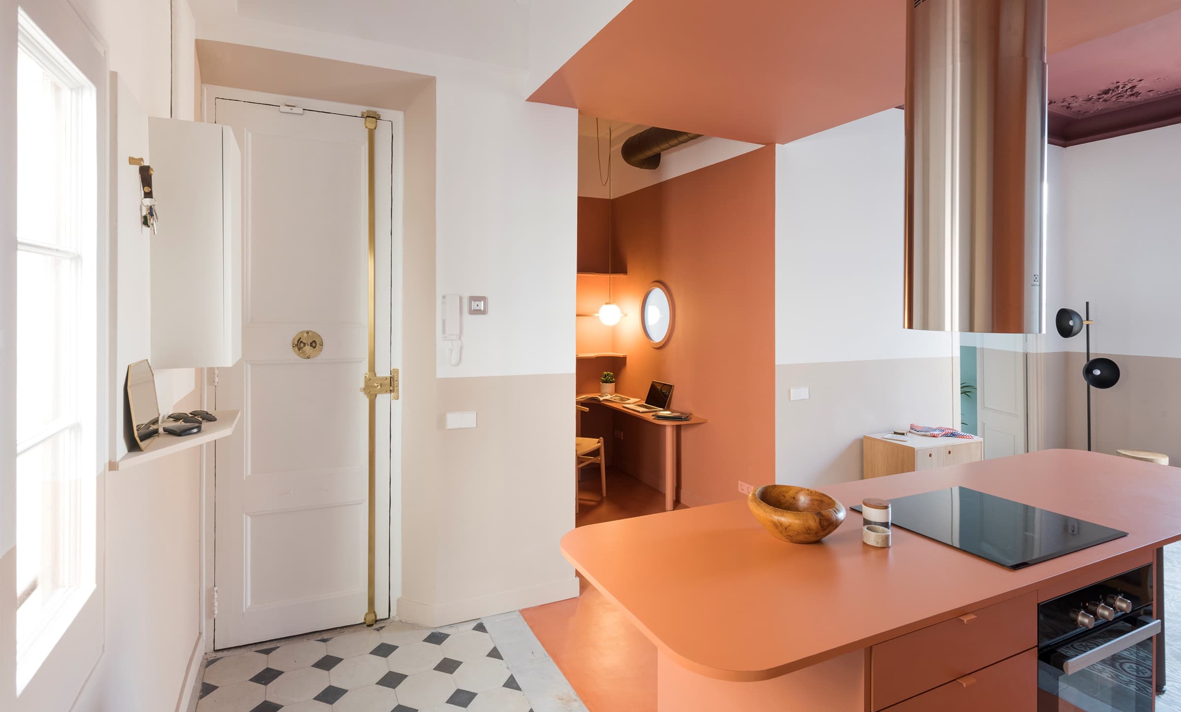 Open plan living with coloured walls in warm tones