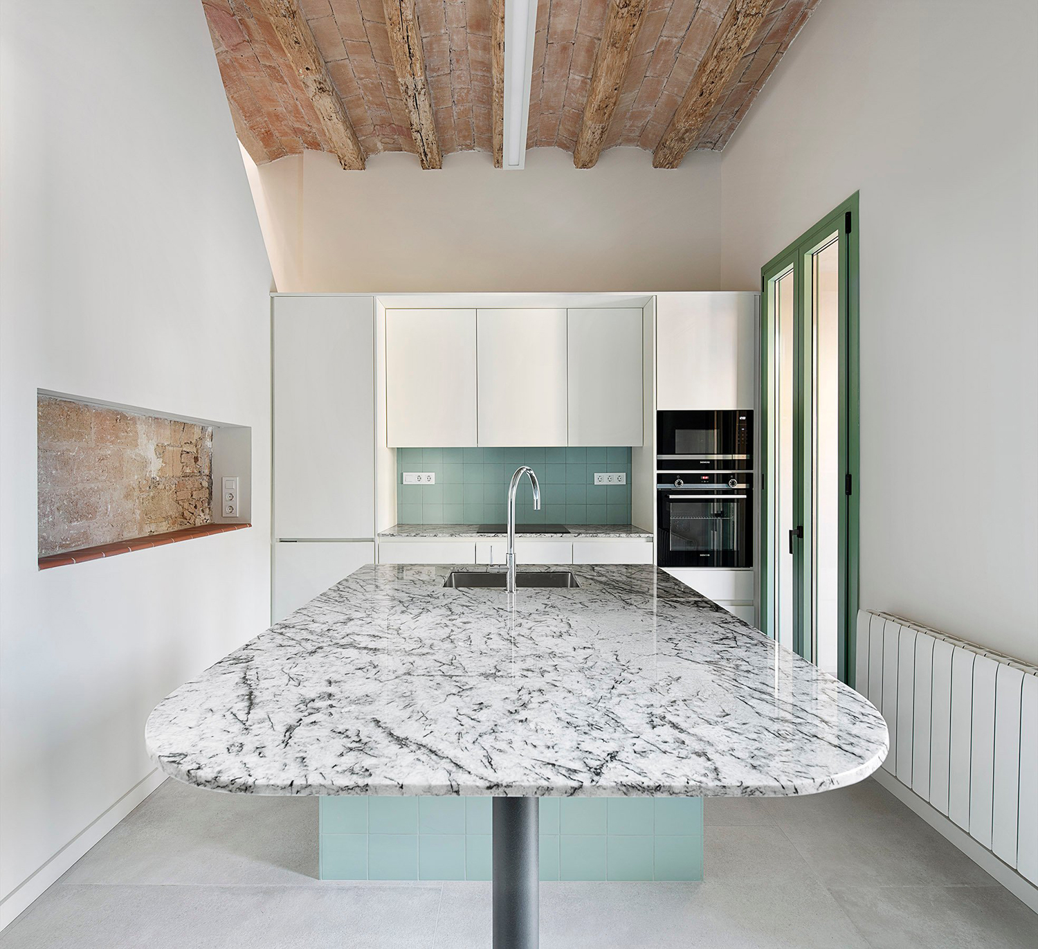 Kitchen with marble center island with sink