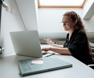 Close-up Photo of Female Architect using Laptop