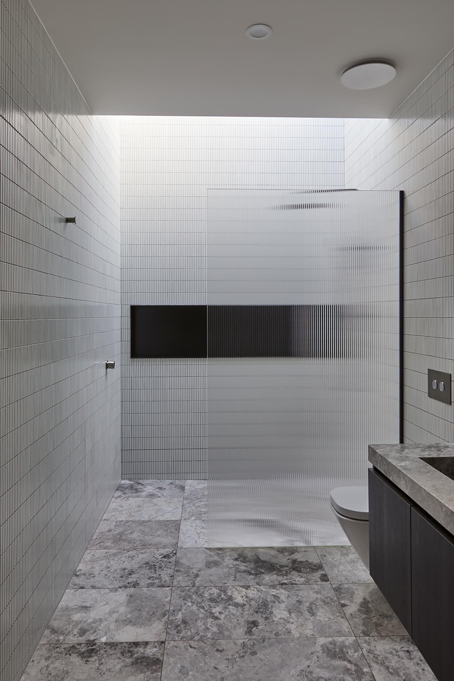Bathroom with frosted glass shower stall