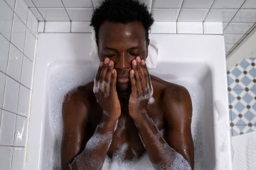 Afro-man takes a bath