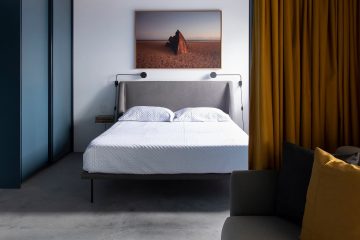 Bedroom with large print above the bed