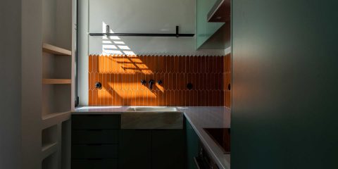 Kitchen with orange tiles
