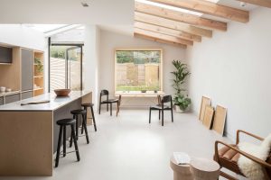 Open-plan kitchen with large aluminum windows