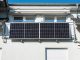 Photovoltaic panels fixed on the facade of a house