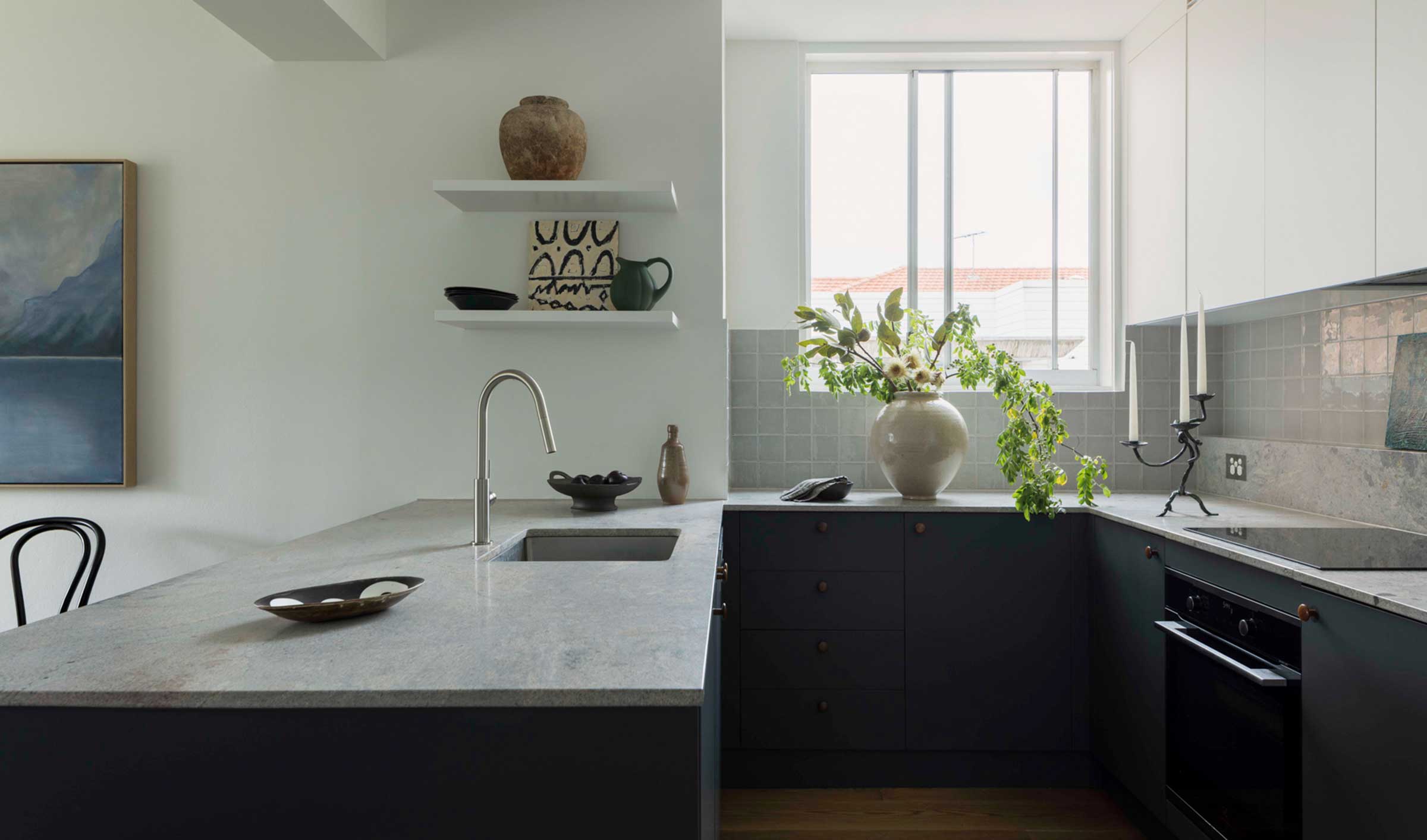 U-shaped kitchen with blue cabinets