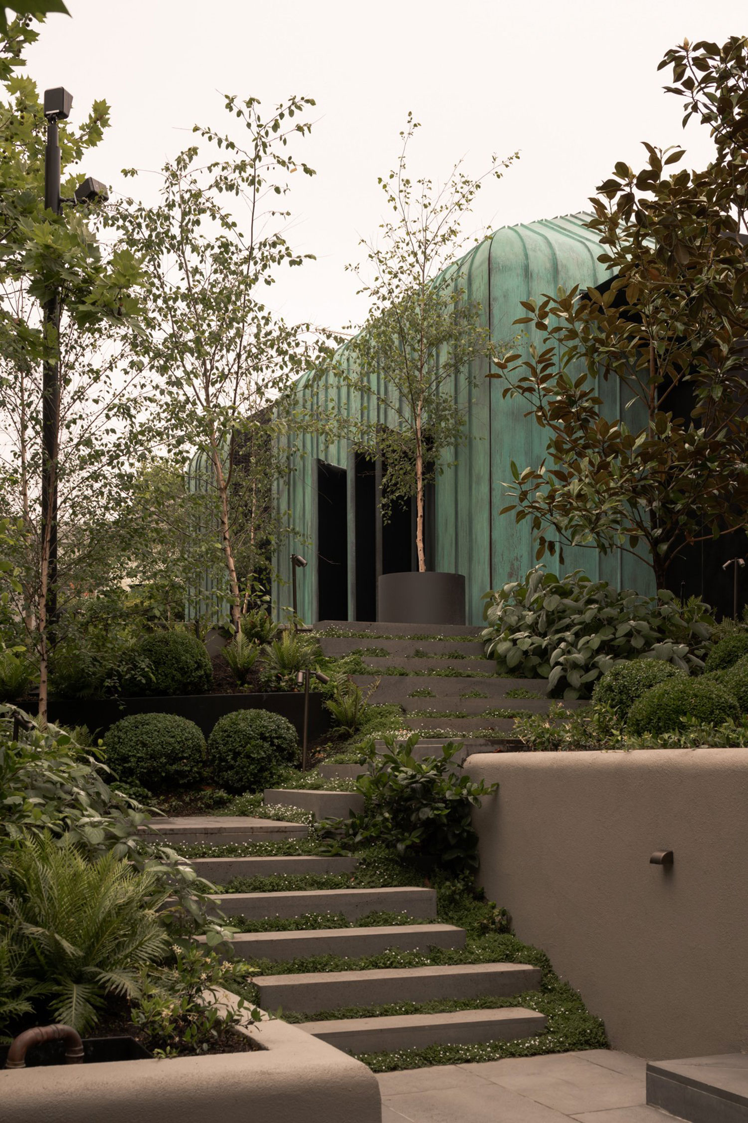 A copper-clad extension by Blur Architects, seamlessly blending modern design with the South Yarra landscape.