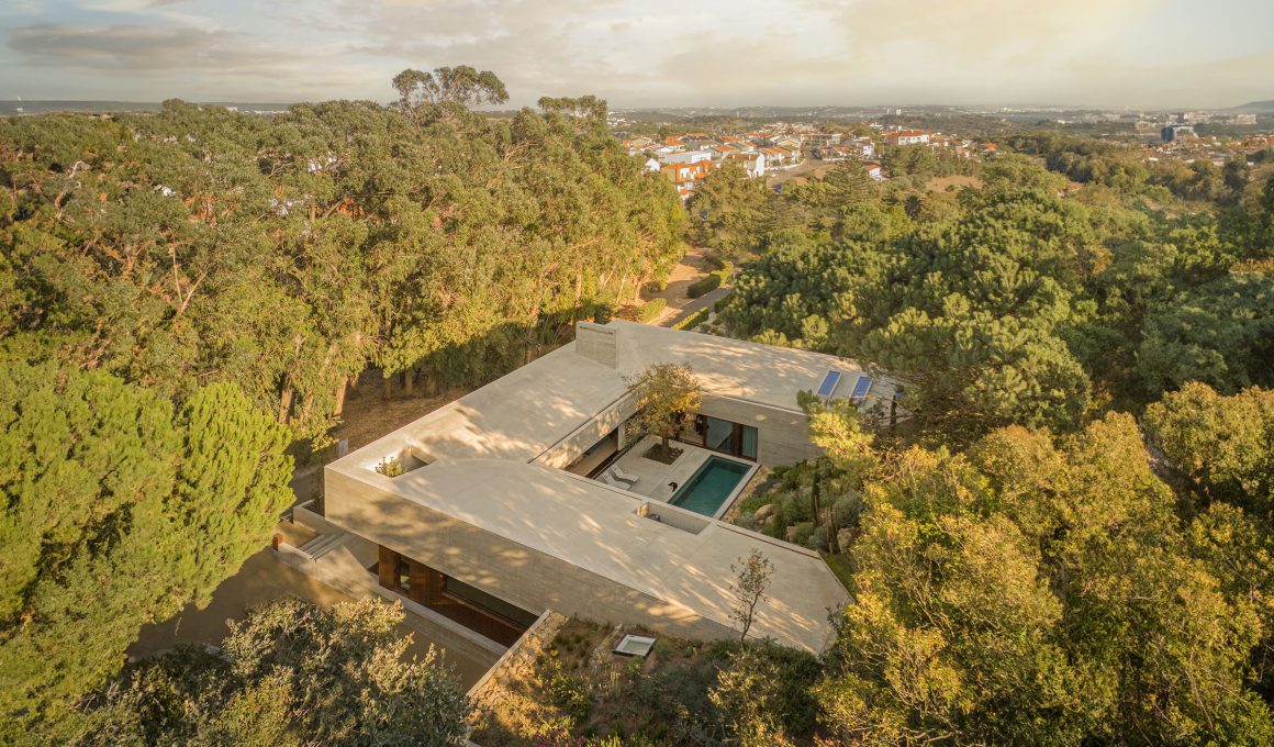 Nestled in Oeiras, Portugal, the Oeiras House by OODA studio seamlessly integrates with the natural landscape