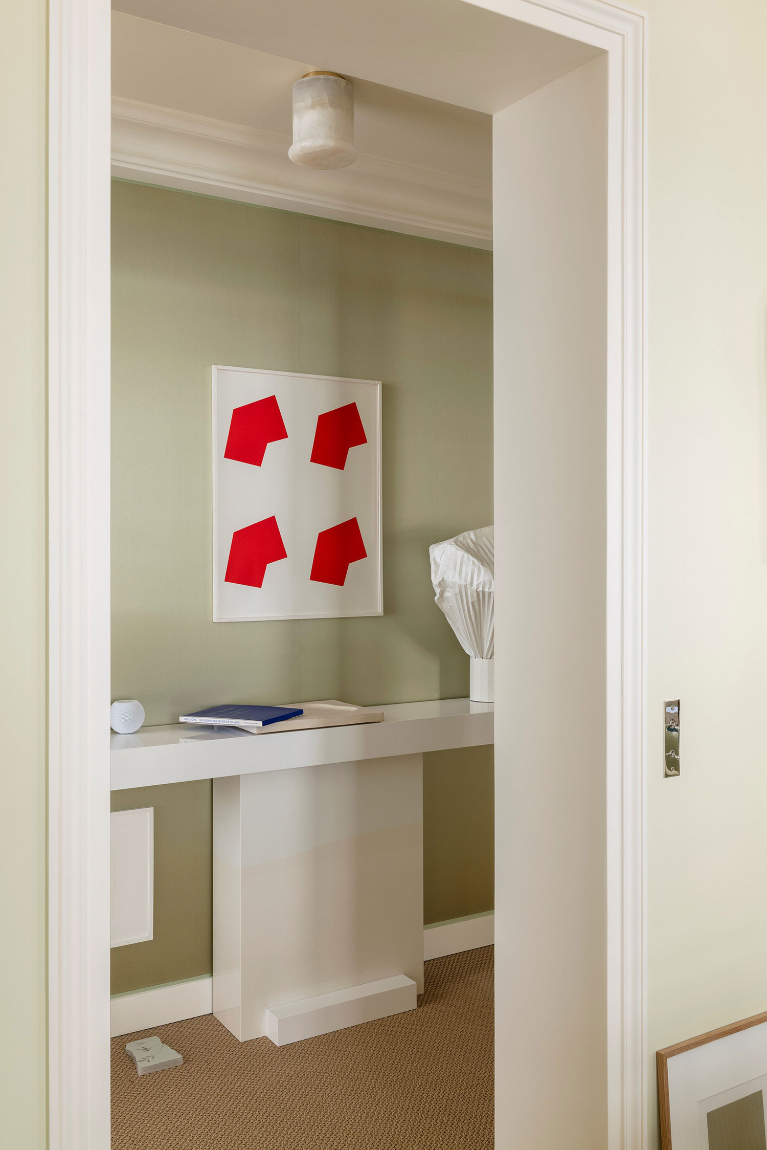 Images showcasing the stunning architectural renovation of a Haussmann apartment in Auteuil, Paris, by After Bach studio. The design blends classic Parisian charm with modern sensibilities, highlighting the use of natural materials, a sophisticated color palette, and curated artwork.