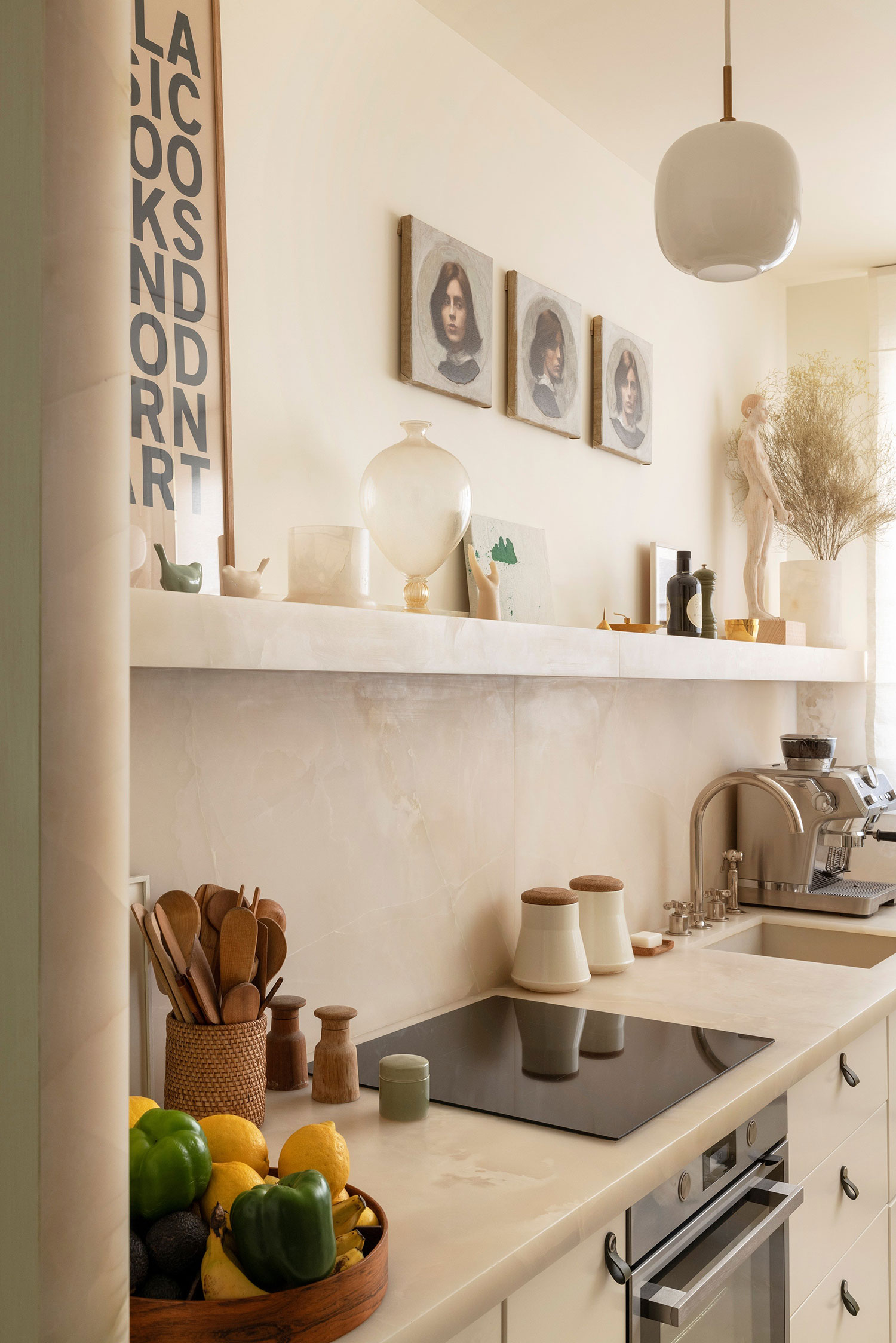 Images showcasing the stunning architectural renovation of a Haussmann apartment in Auteuil, Paris, by After Bach studio. The design blends classic Parisian charm with modern sensibilities, highlighting the use of natural materials, a sophisticated color palette, and curated artwork.