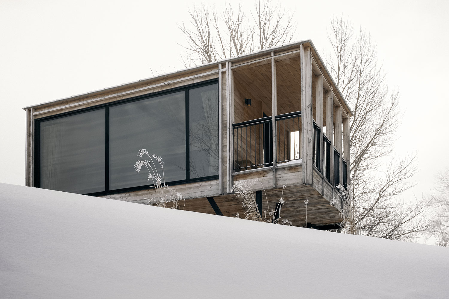 The Cache: A Modern Stilt House on Lake Saint-Jean by Delordinaire Architects