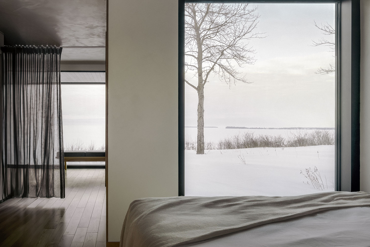 The Cache: A Modern Stilt House on Lake Saint-Jean by Delordinaire Architects