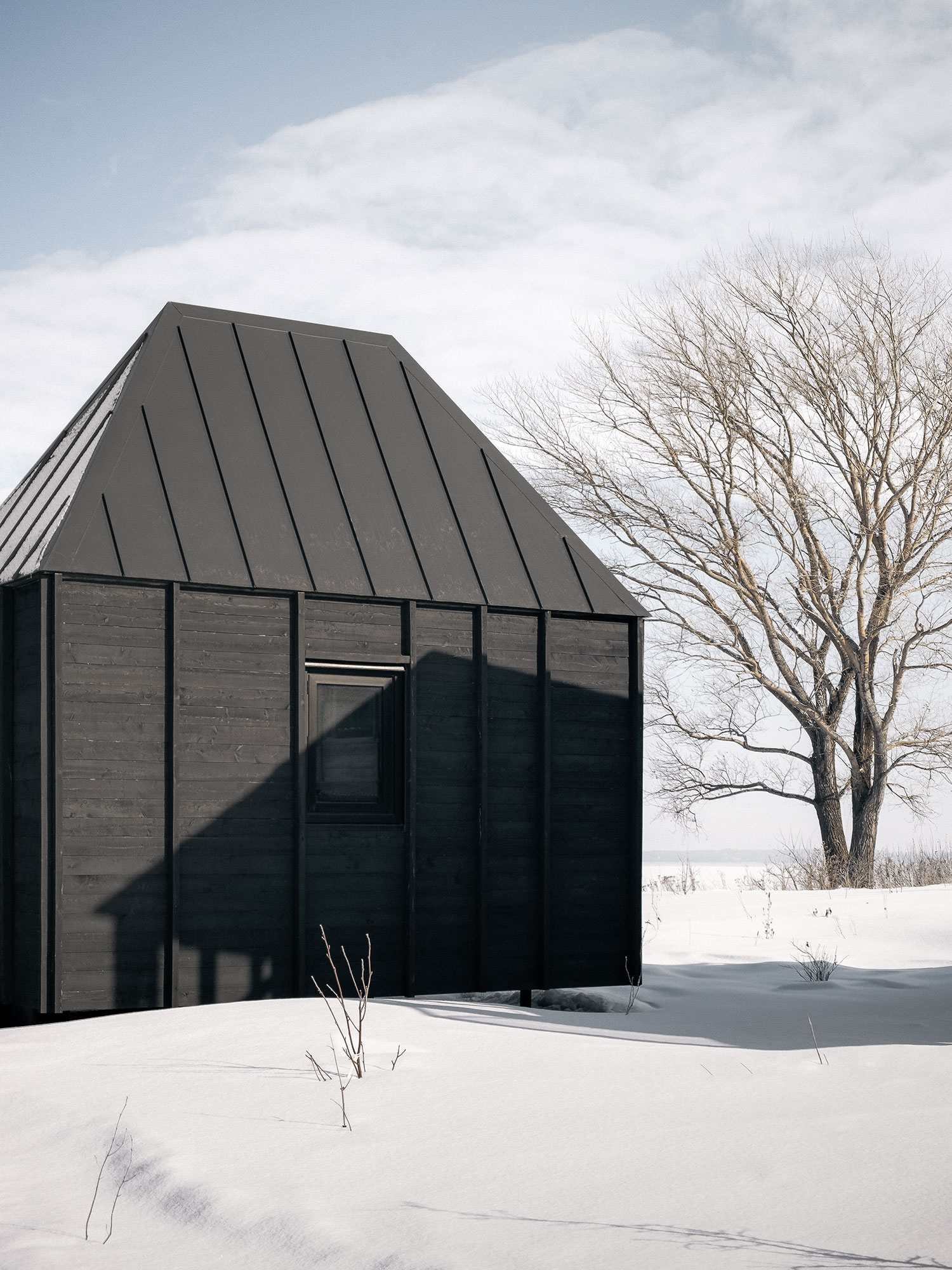 The Cache: A Modern Stilt House on Lake Saint-Jean by Delordinaire Architects