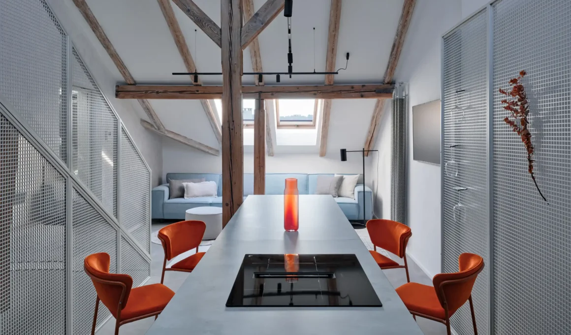 Arbes Square Apartment by Formafatal: A bright Prague attic renovation with bleached wood, dark volumetric inserts, and asymmetrical historic beams.