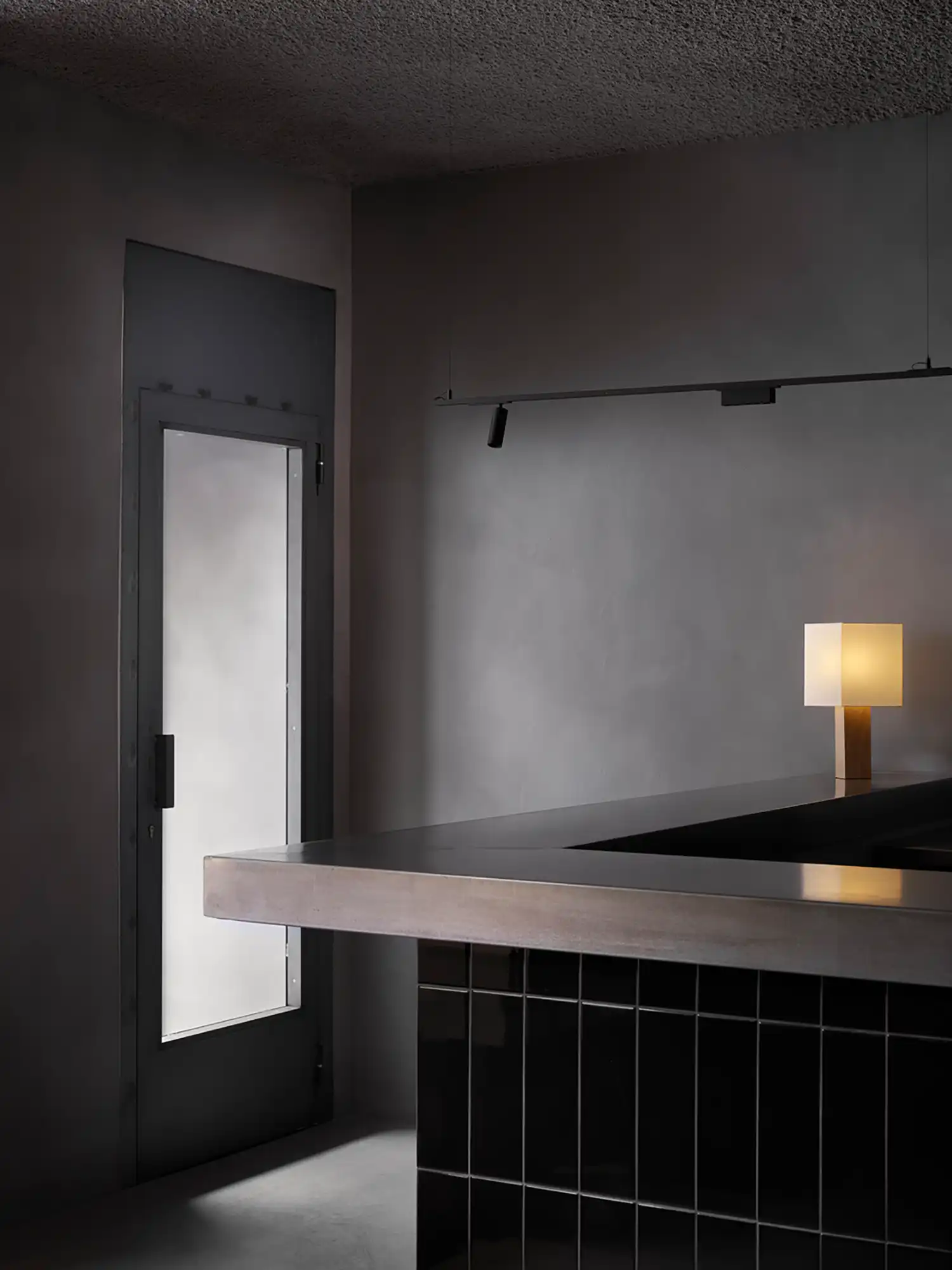 BAKKO Restaurant in Madrid Channels the Subtle Drama of Japanese Aesthetics Through Dark Materials and Shadow Play