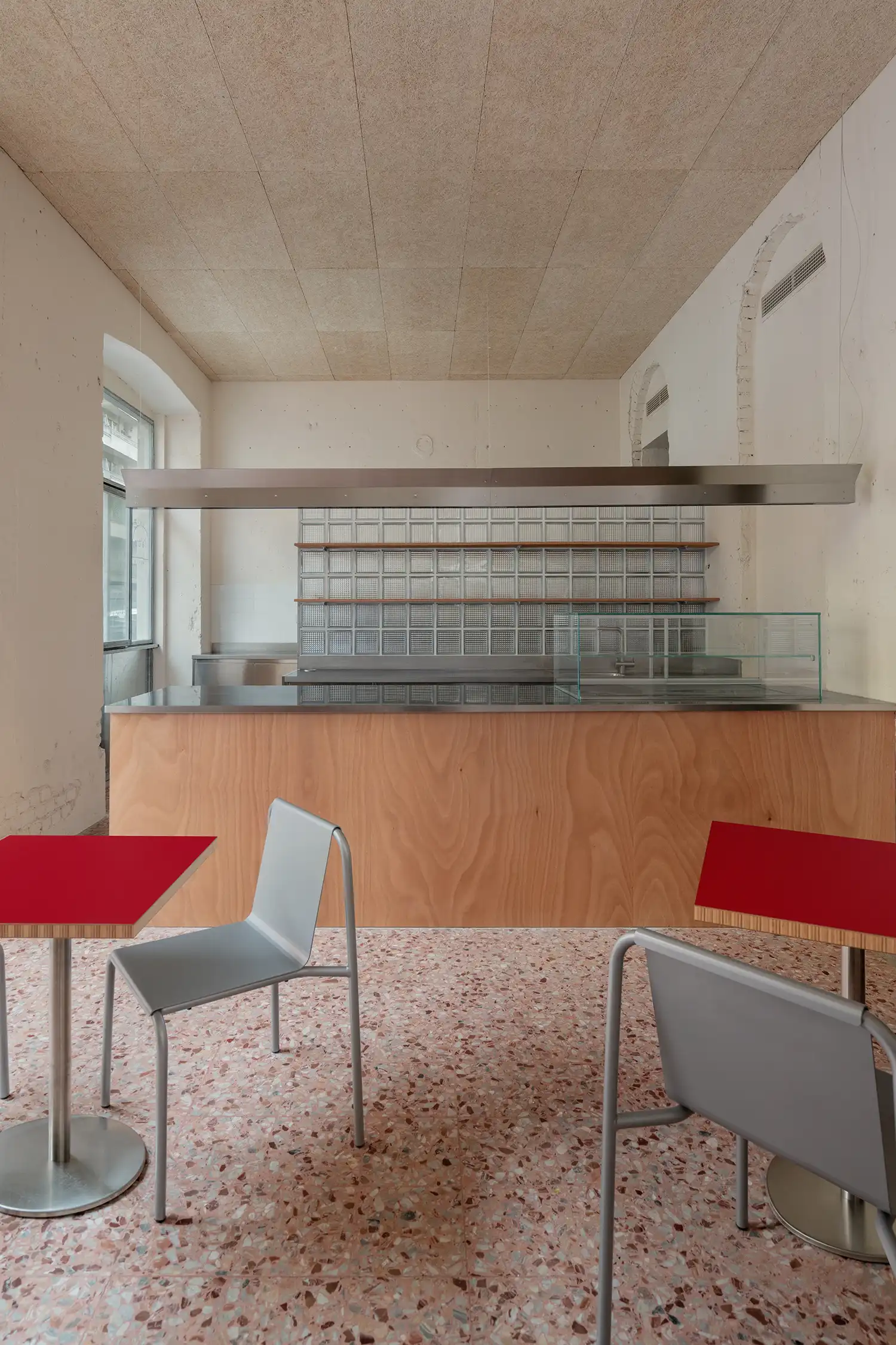 Original terrazzo flooring preserved in L'ALTRO Milan, showcasing Sagoma Studio’s respect for historic architecture