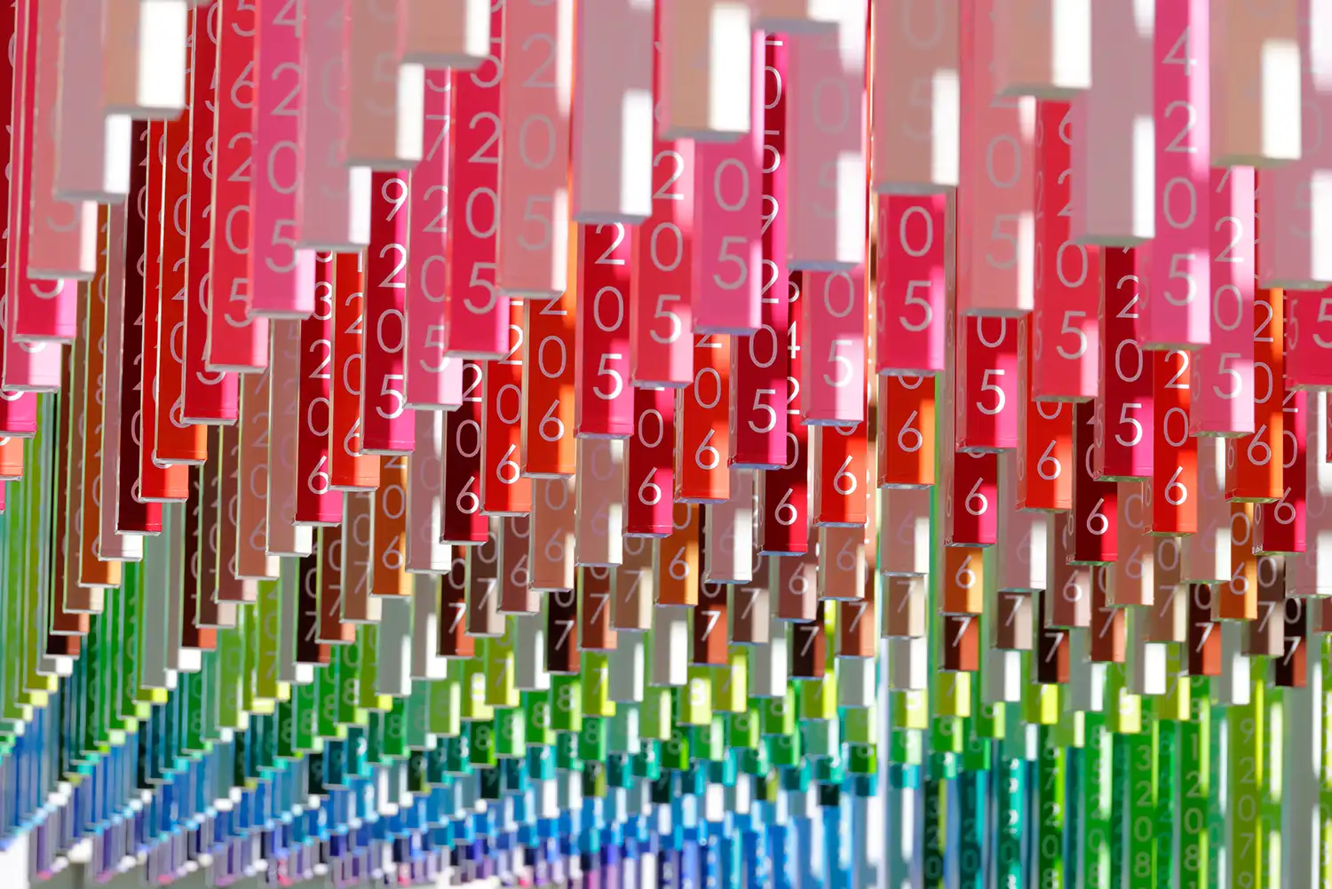 Close view of color-strands etched with future years in Moureaux's 100 colors series installation, showing moiré pattern effect.