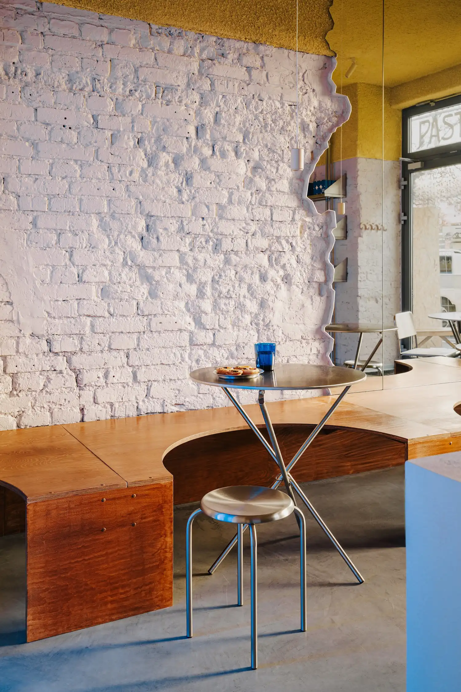 Deep marine blue branding element with metallic accents at Pastelowe cafe. Reflects surf-inspired color palette by Znamy Sie design studio.