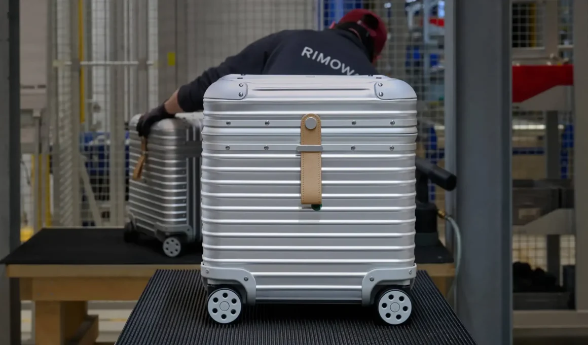 Rimowa and Vitra aluminium collaboration: minimalist silver stool and modular toolbox with grooved design.