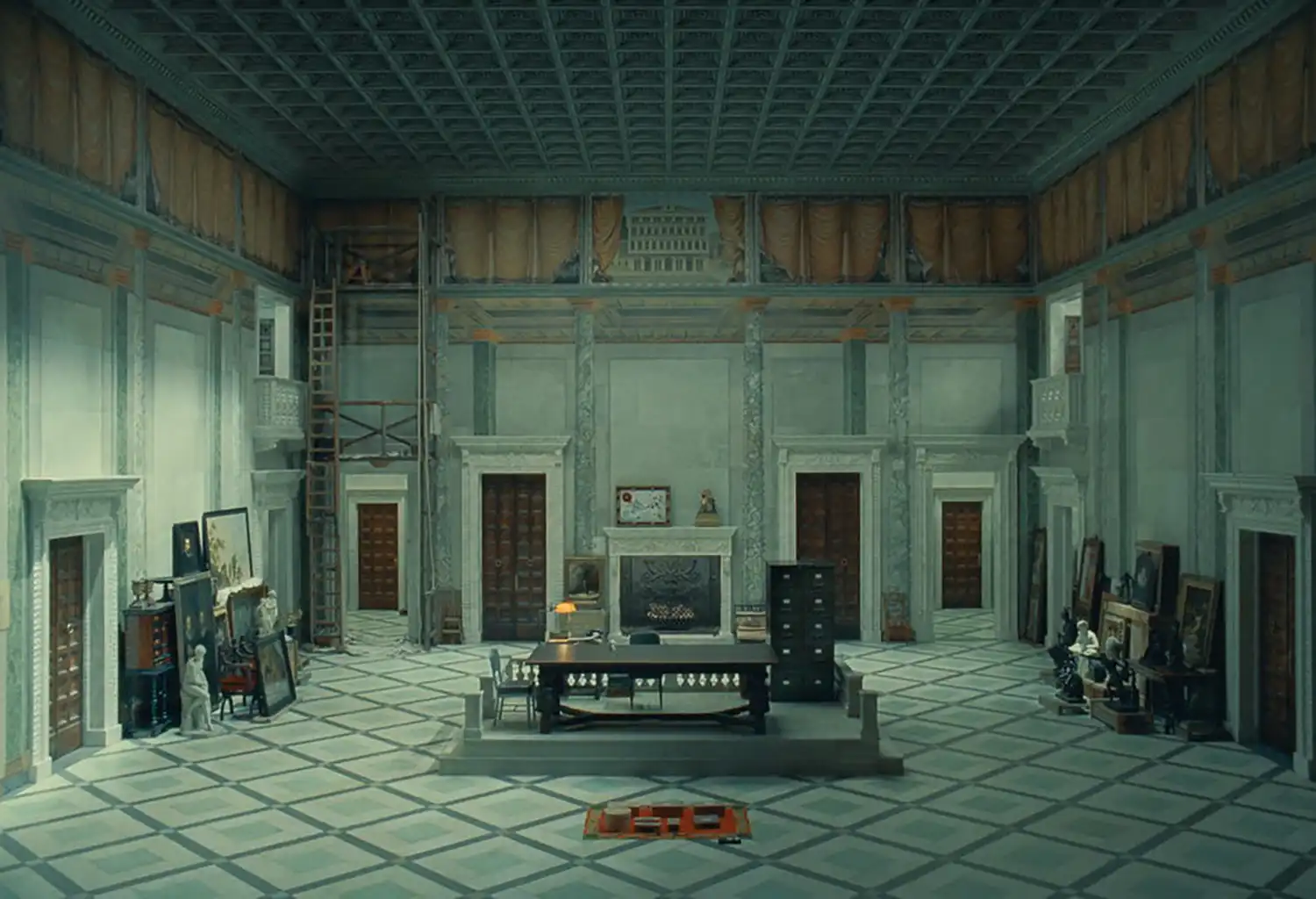 Cinematic still from "The Phoenician Scheme" showcasing retro-futuristic architecture and detailed production design.