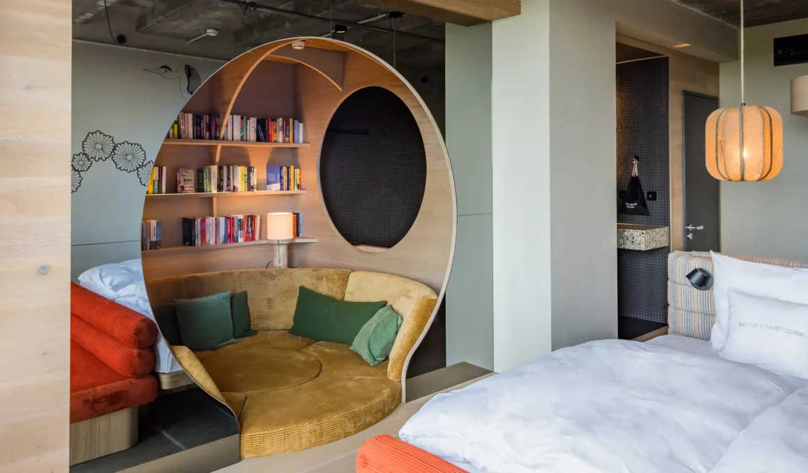 studio aisslinger’s Urban Jungle redesign at 25hours Hotel Bikini Berlin: panoramic Monkey Bar overlooking Tiergarten with rattan lounges and lush greenery.