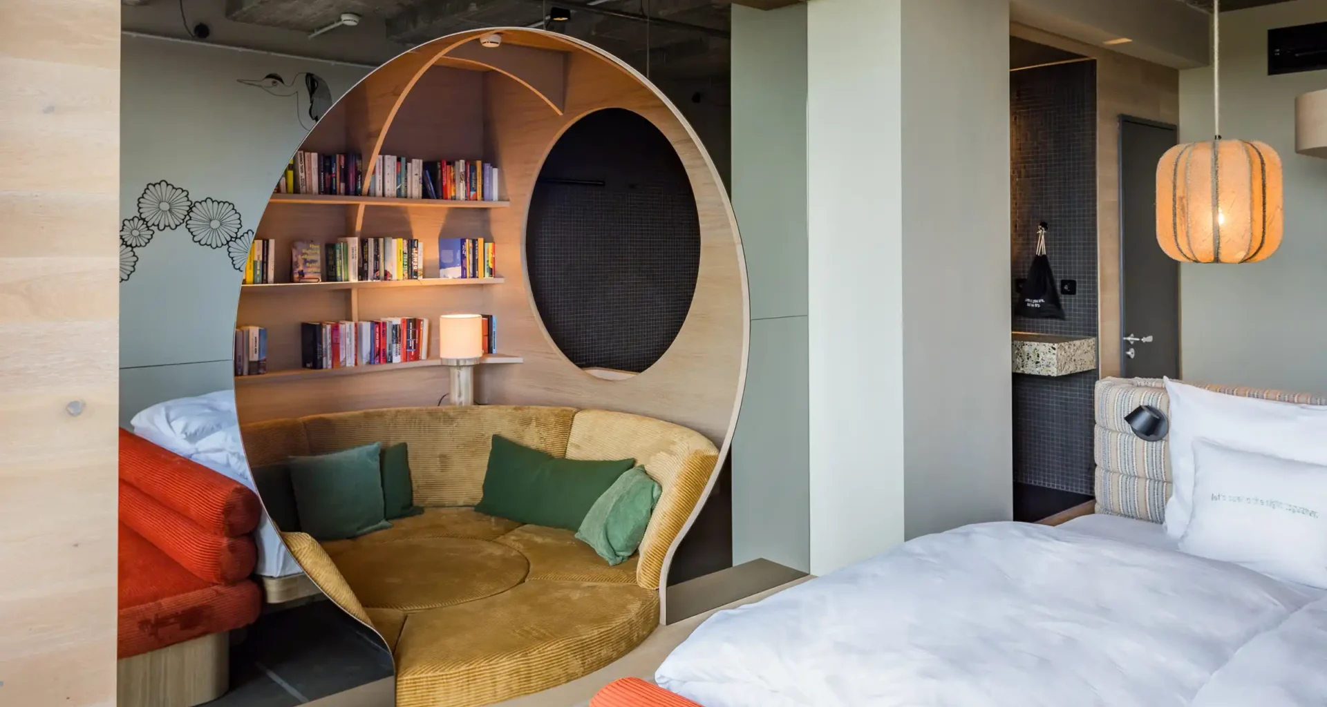 studio aisslinger’s Urban Jungle redesign at 25hours Hotel Bikini Berlin: panoramic Monkey Bar overlooking Tiergarten with rattan lounges and lush greenery.