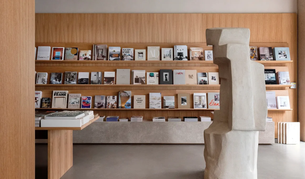 Minimalist coffee table books display at New Mags Bookstore by Norman Architects | urdesign