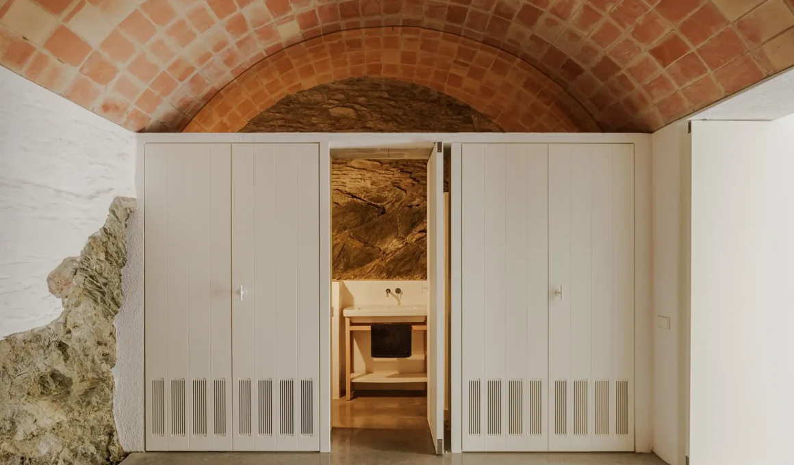 Fisherman’s House renovated facade in Cadaqués white village, Spain. Bea Portabella Jordi Pages sensitive restoration of stone architecture.