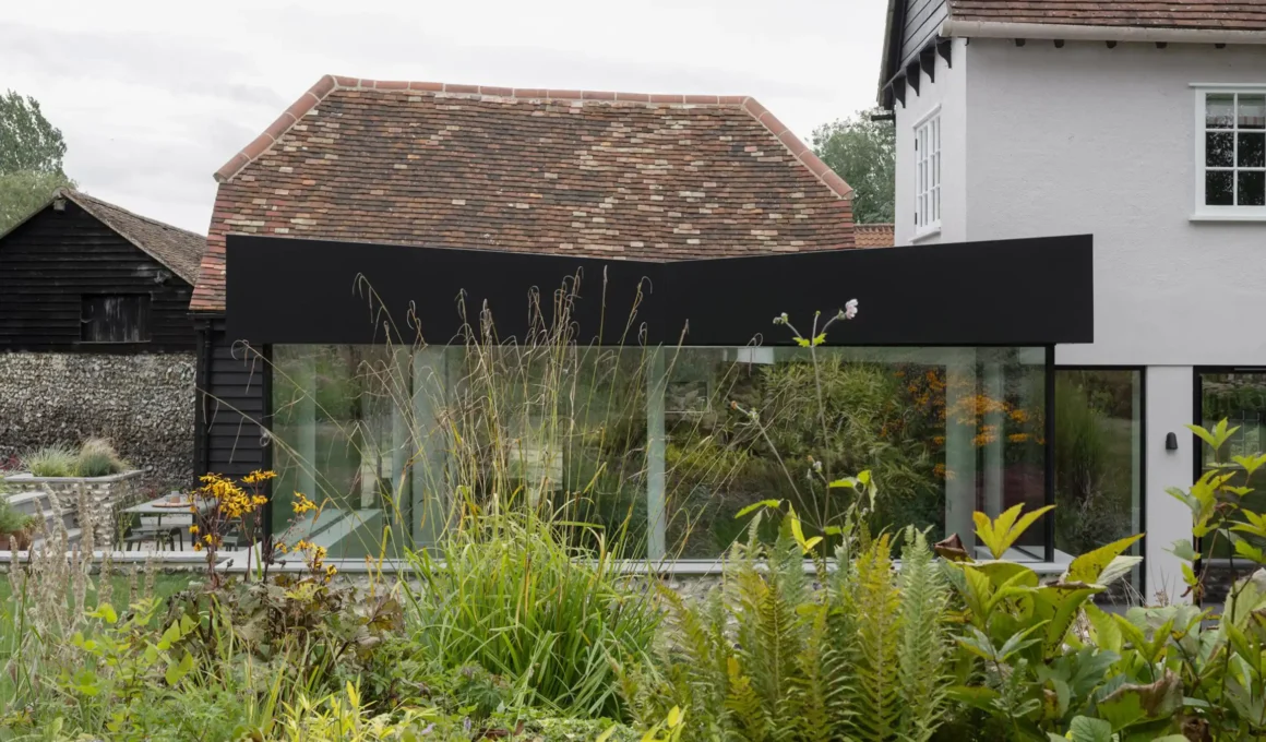 Flint Farm Restoration: Grade II Hertfordshire Farmhouse with Knapped Flint & Black Steel Extension by Will Gamble Architects