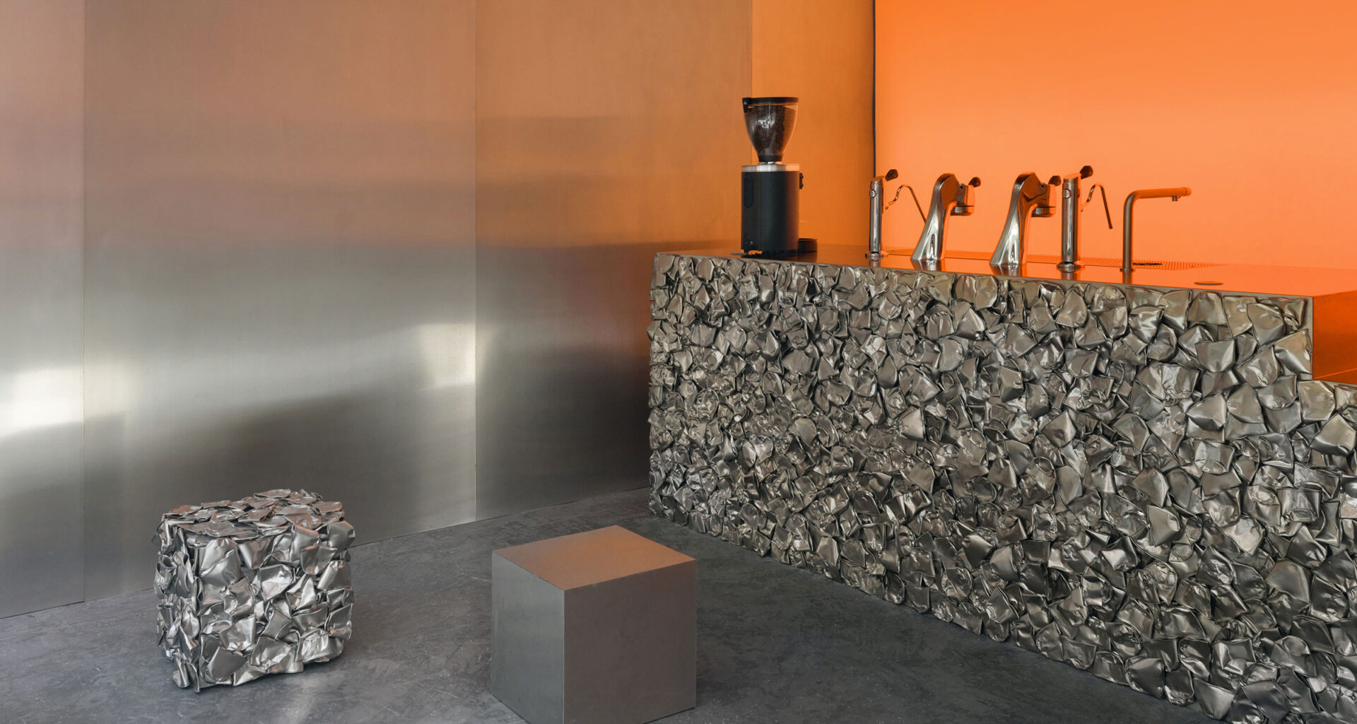 Crosby Studios Café Nuances Paris: gleaming inox countertop with light reflections at Marais café