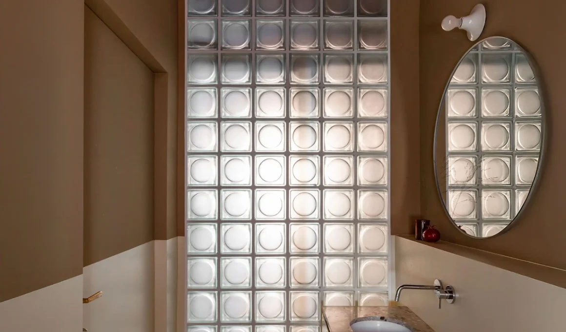 Contemporary glass brick facade diffusing natural light in modern architecture | Thermal insulation + privacy