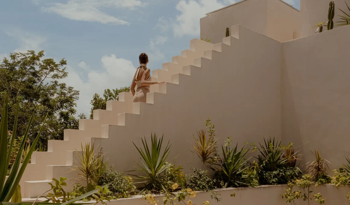 Jungle staircase at RA!-designed Hacienda Wabi in Tulum, Mexico: stepped stone volumes with Chukum finish amid tropical vegetation.