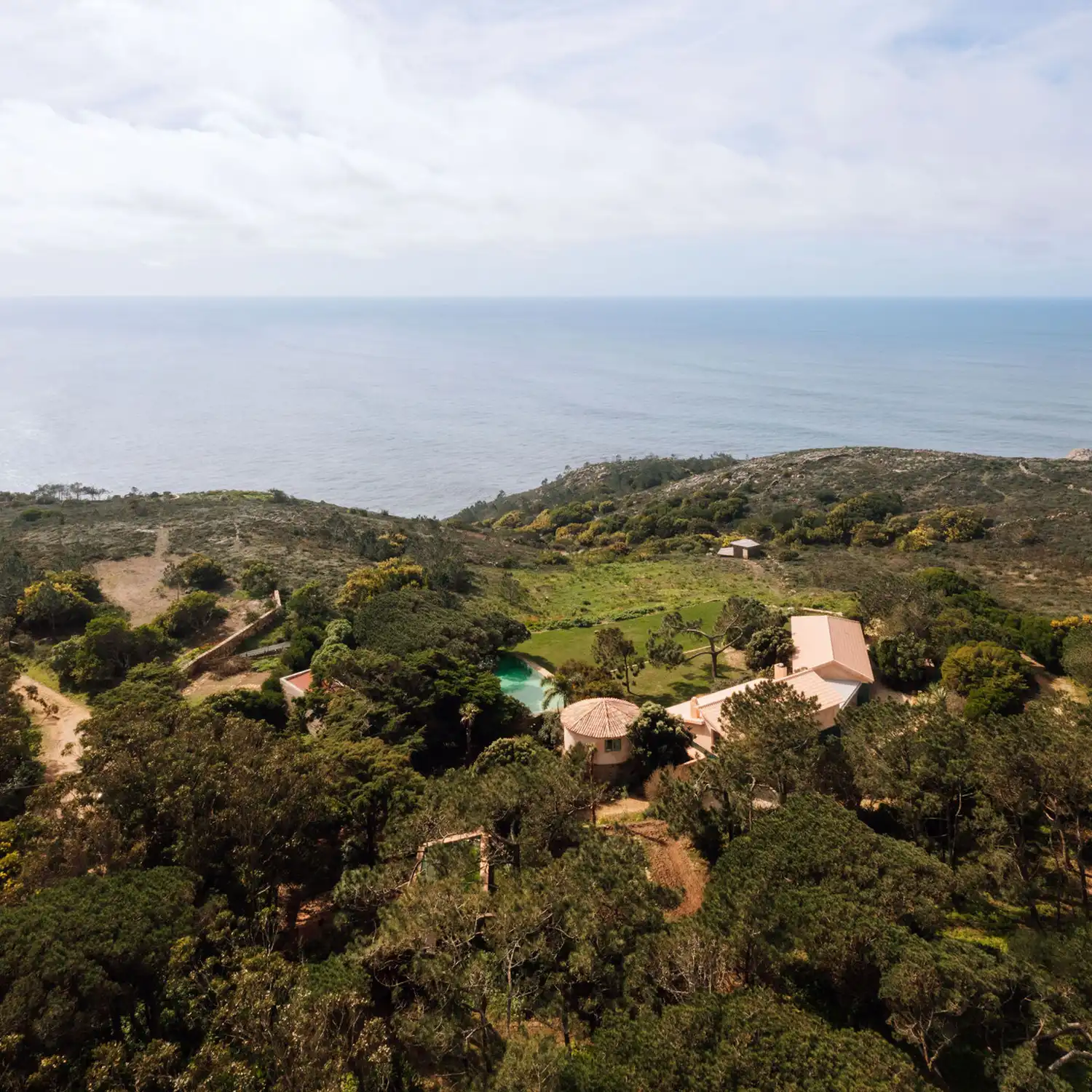 Vanishing Act: House Azóia AIP Blurs into the Portuguese Cliffscape by João Tiago Aguiar Arquitectos